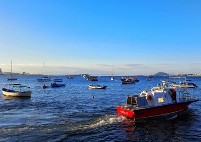 Boats sailing in sea