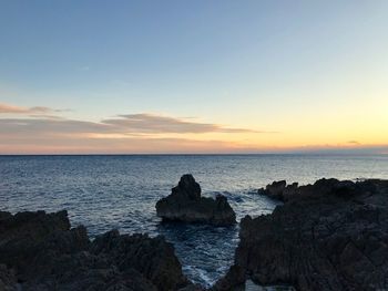 Scenic view of sea against sky during sunset