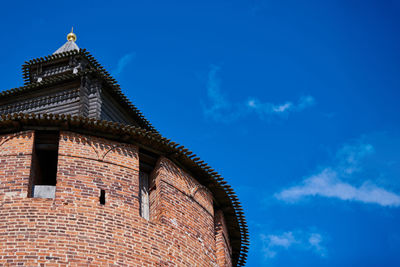 Low angle view of building against blue sky