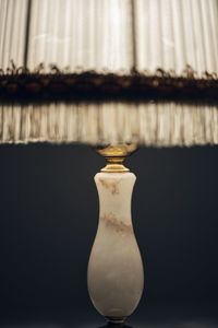 Close-up of electric lamp on table