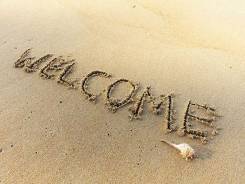 Text on sand at beach