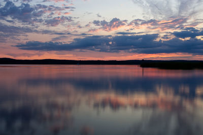 Scenic view of lake against romantic sky at sunset