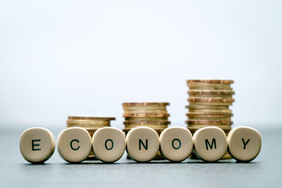 Close-up of coins over white background