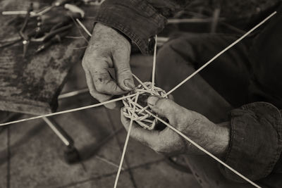 Midsection of man making artwork