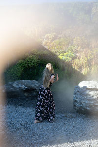 Side view of woman standing in water