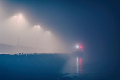 Scenic view of sea against sky during foggy weather