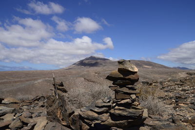 Rocks on mountain against sky