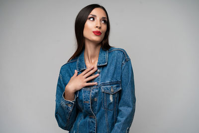 Portrait of a beautiful young woman over white background