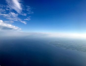 Aerial view of landscape against blue sky