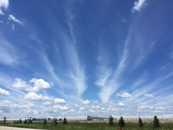 Scenic view of landscape against blue sky