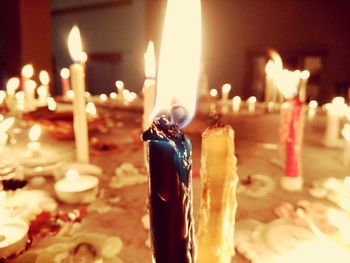 Close-up of candles on table