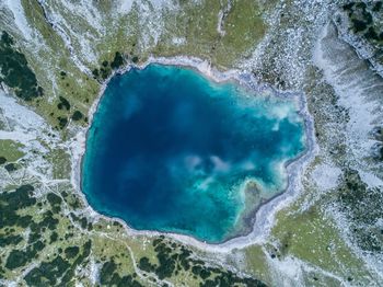 Areal view of the dragonlake in the austrian alps.