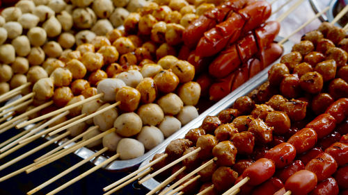 High angle view of food in skewers in market for sale