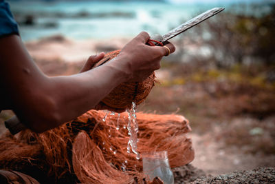 Close-up of hand holding water