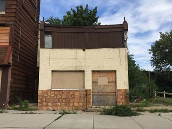 Exterior of building by street against sky