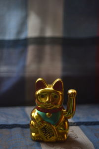 Close-up of figurine sculpture on table