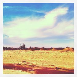 Scenic view of landscape against cloudy sky