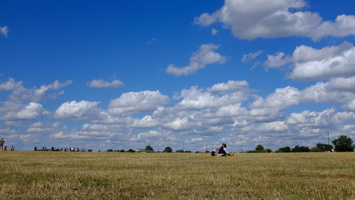 Scenic view of agricultural field against sky