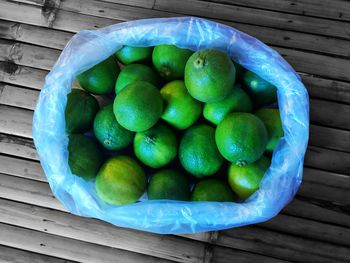 High angle view of fruits in basket on table