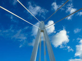 Low angle view of bridge against blue sky