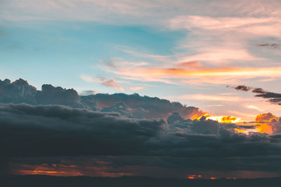 Low angle view of dramatic sky during sunset