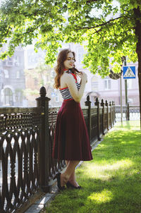 Portrait of young, happy, elegant redhead curly woman, girl in hat, casual clothes. french style. 