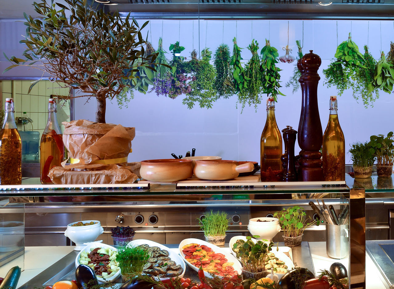 POTTED PLANTS ON TABLE IN RESTAURANT