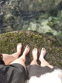 Low section of people relaxing on water