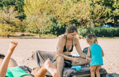 Family sitting on the beach