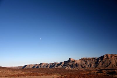 View of desert against blue sky