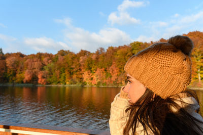 Girl on tourist boat in plitvice lakes national park in croatia in autumn