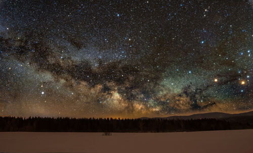 Scenic view of star field against sky at night