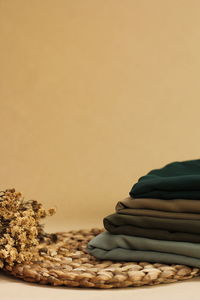 Close-up of stack on table against white background