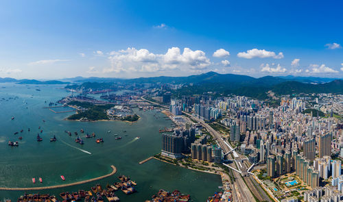 High angle view of city against cloudy sky