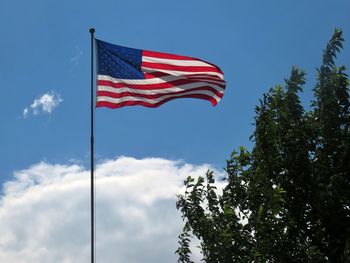 Low angle view of flag against sky