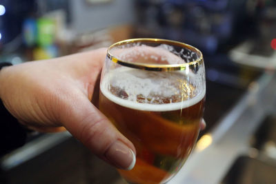 Close-up of hand holding drink