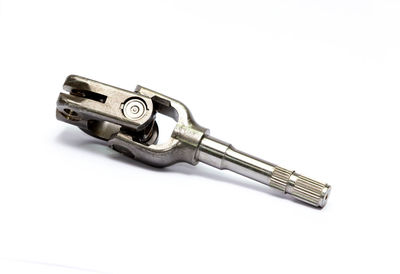 Close-up of machine part against white background
