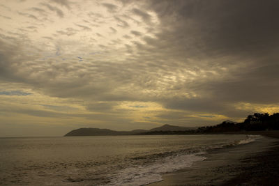 Scenic view of sea against sky at sunset