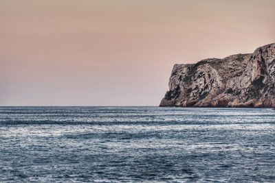 Scenic view of sea and clear sky during sunset
