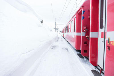 Train on snow covered landscape during winter