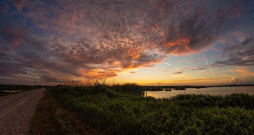 Scenic view of road against sky during sunset