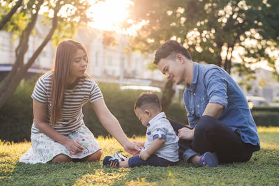 Family sitting on lawn