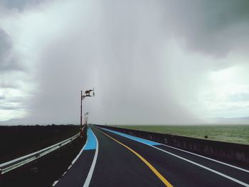 View of road against cloudy sky