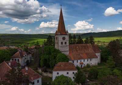 High angle view of trees and buildings against sky