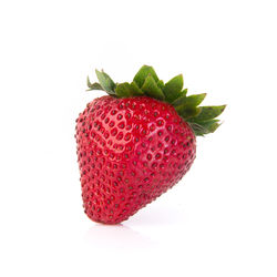 Close-up of strawberry over white background