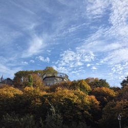 Low angle view of building against cloudy sky