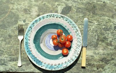 High angle view of fruits in plate on table