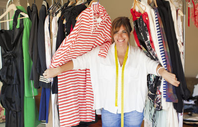 Happy women standing in traditional clothing at store