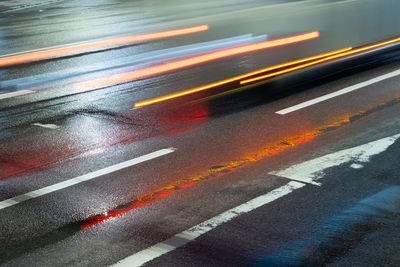 High angle view of light trails on road