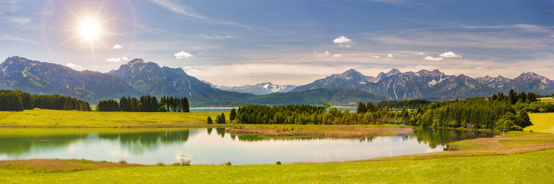 Scenic view of lake and mountains against sky in bavaria, germany